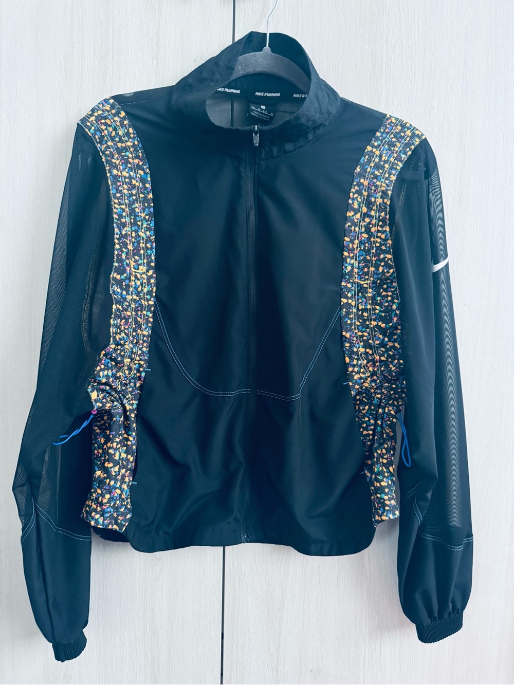 Nike Black Women’s Varsity Running Jacket with Multicolor Panels and Mesh detail